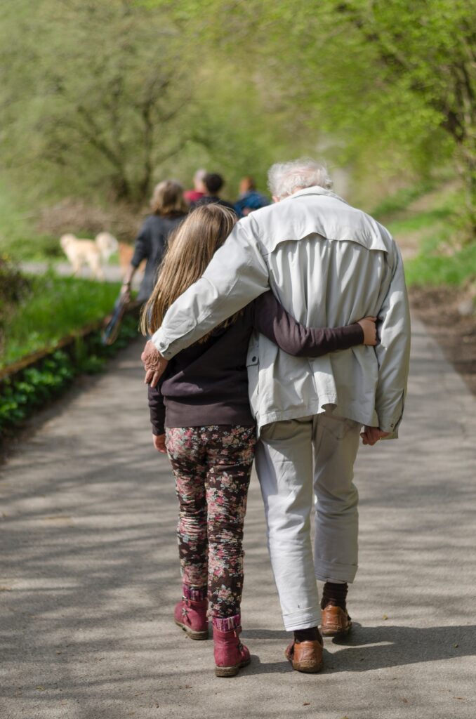 resident and grandchild walking