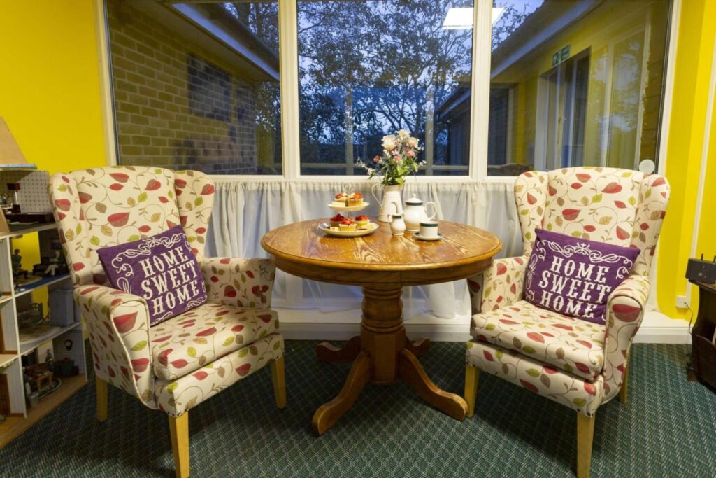 Seating area in lounge at Upper Mead Care Home