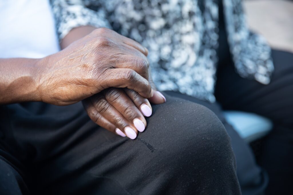 elderly holding hands