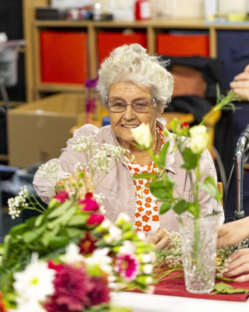 resident doing flower picking