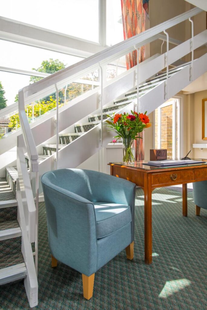 A well lit stairwell at Upper Mead care home